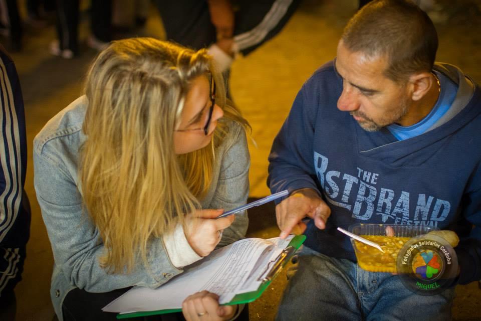 A Projects Abroad intern talks to a homeless man as part of her Human Rights work experience in Argentina. A student assists a homeless man during her Human Rights internships in Argentina.